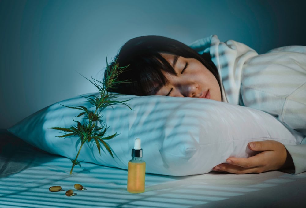 An Asian girl sleeping after taking a weed treatment for insomnia.